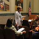 Image of a woman asking a question during a meeting in the North Hearing Room.